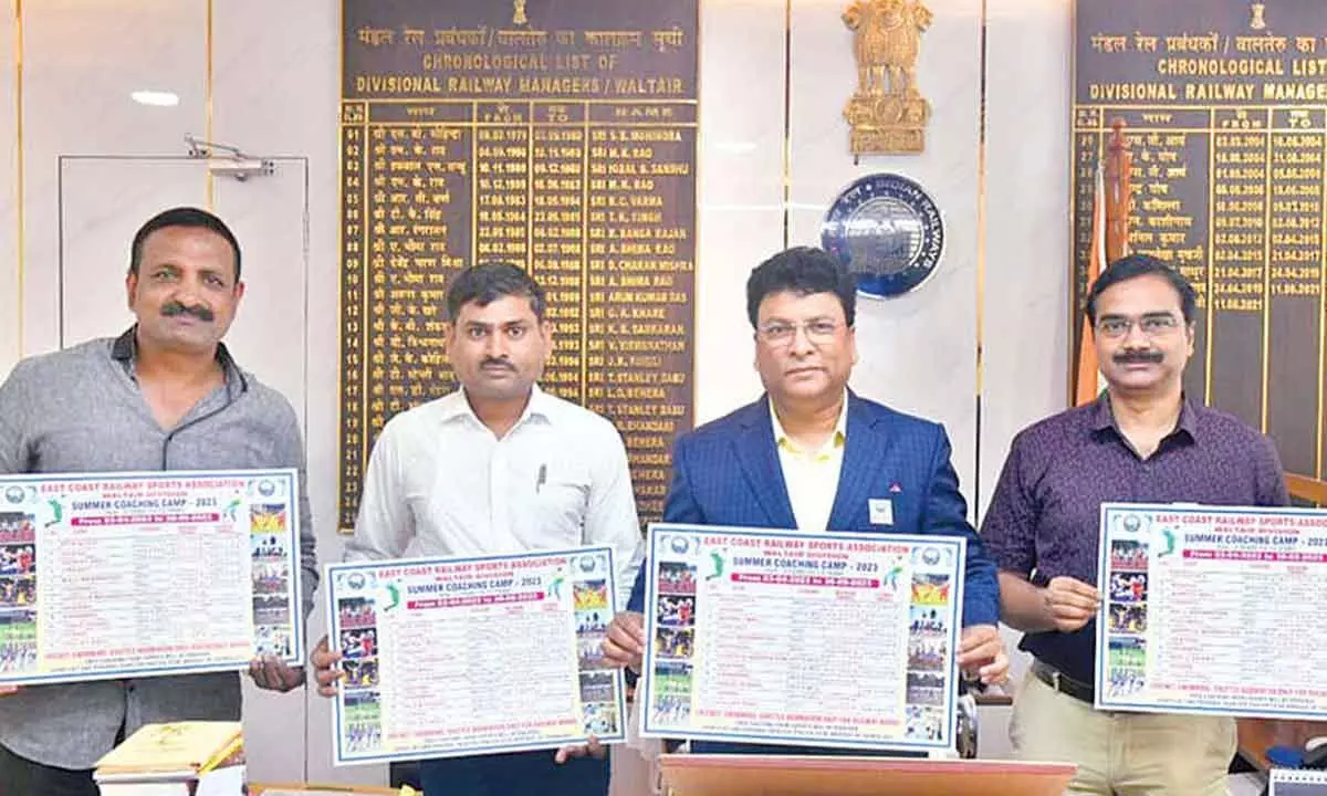 Waltair DRM and other personnel launching a poster for the summer coaching camp of East Coast Railway Sports Association-Waltair in Visakhapatnam