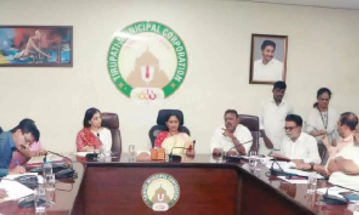 Mayor Dr R Sirisha, Municipal Commissioner Anupama Anjali and others with the Corporation revenue team in Tirupati on Monday