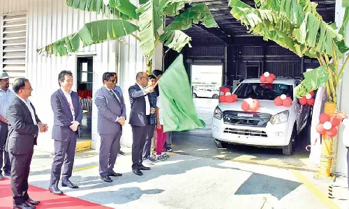 Additional Commissioner of Customs S Narasimha Reddy flagging off the ISUZU’s export  vehicle at Sri City on Tuesday. Sri City MD Ravindra Sannareddy, Rajesh Mittal and  Toru Kishimoto are also seen.