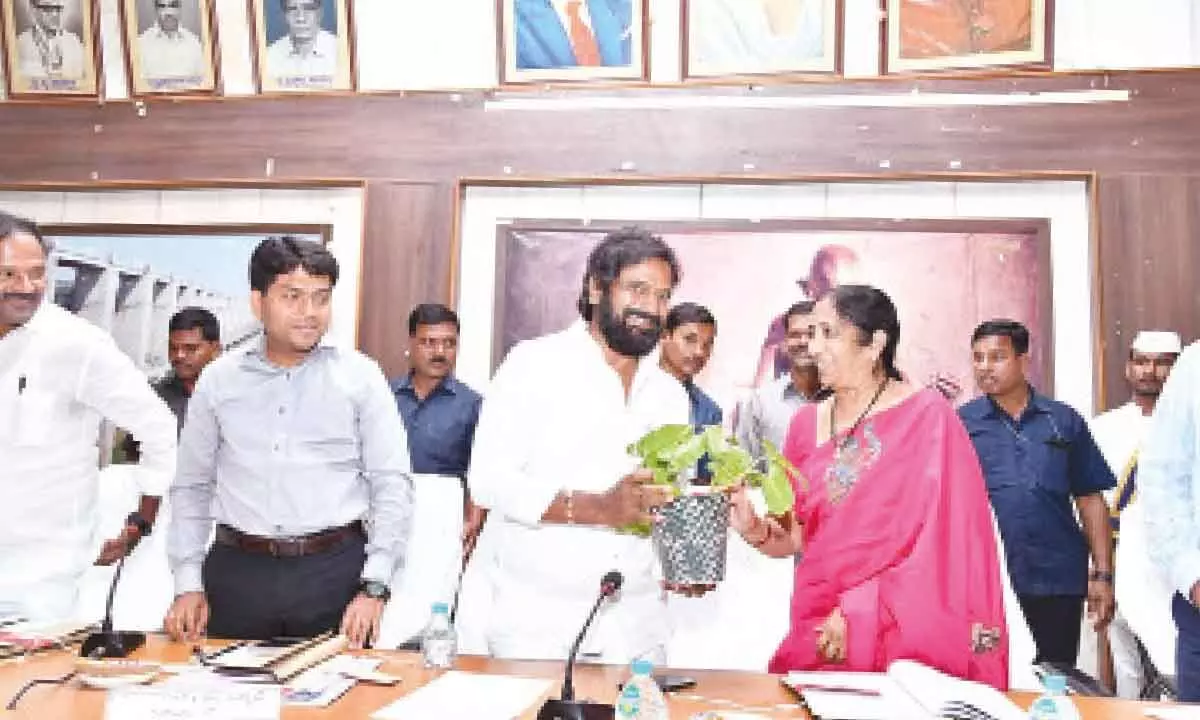 Excise Minister Srinivas Goud presenting a plant to ZP Chairman Swarnasudhar Reddy at the all- party ZP meeting in Mahabubnagar on Tuesday