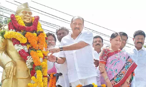 Ongole MLA Balineni Srinivasa Reddy and others garlanding the statue of Babu Jagjivan Ram at Nellore Bus Stand Centre in Ongole on Wednesday
