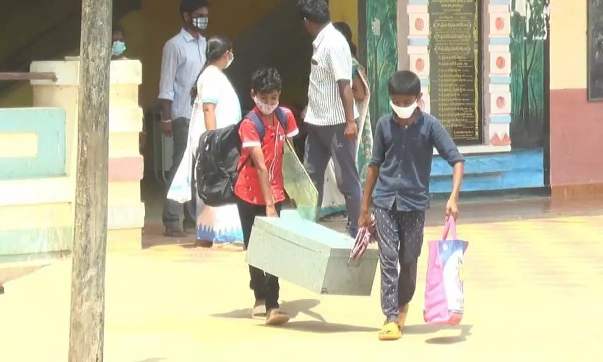 Students heading to their homes from the Tribal Welfare Boys Residential School in  Mahabubabad on Thursday