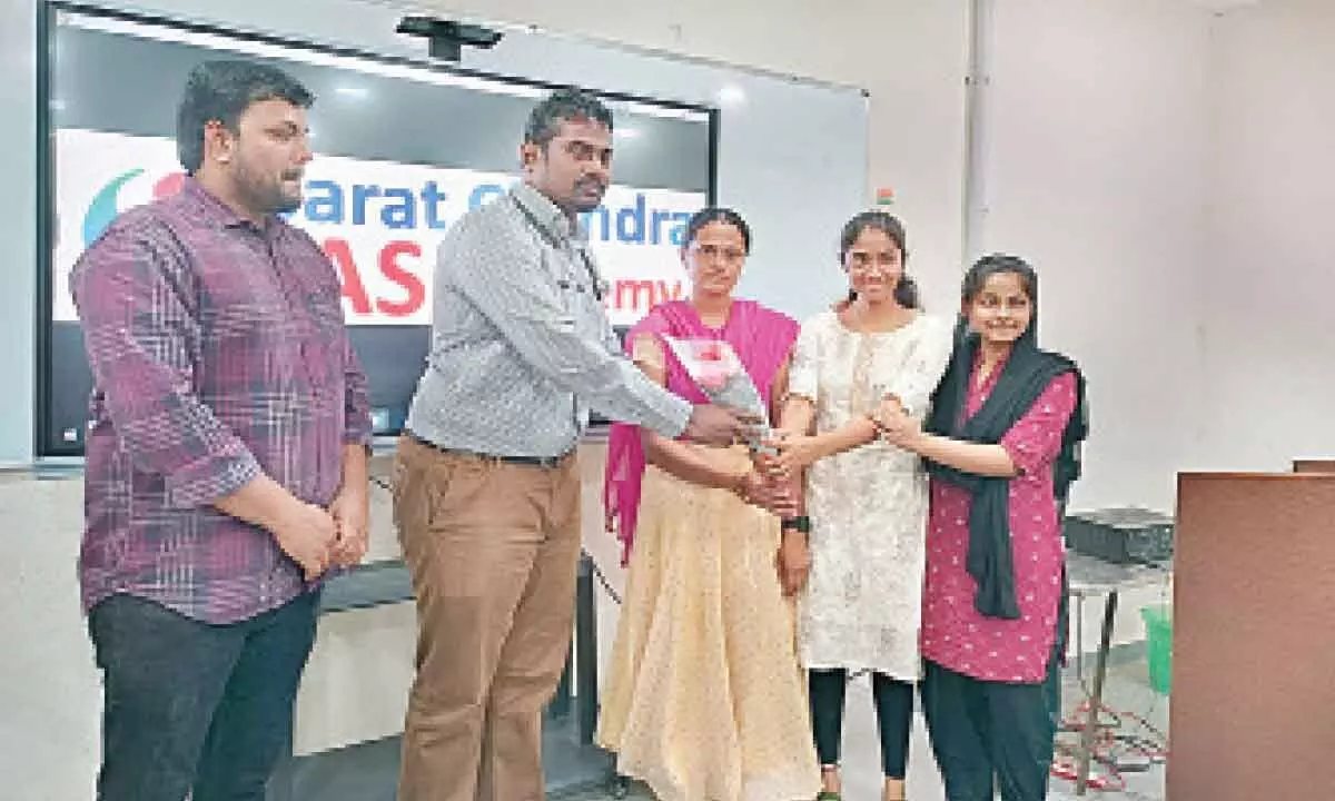 Students presenting a bouquet to Dr Krishna Harish at a programme at Sarath Chandra IAS Academy in Vijayawada on Friday