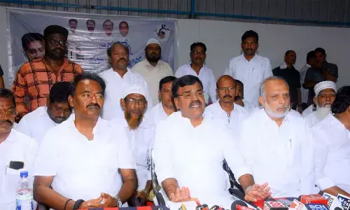 Deputy Chief Minister Amzath Basha addressing a press conference after launching Jagananne Maa Bhavishyathu, in Kadapa on Friday