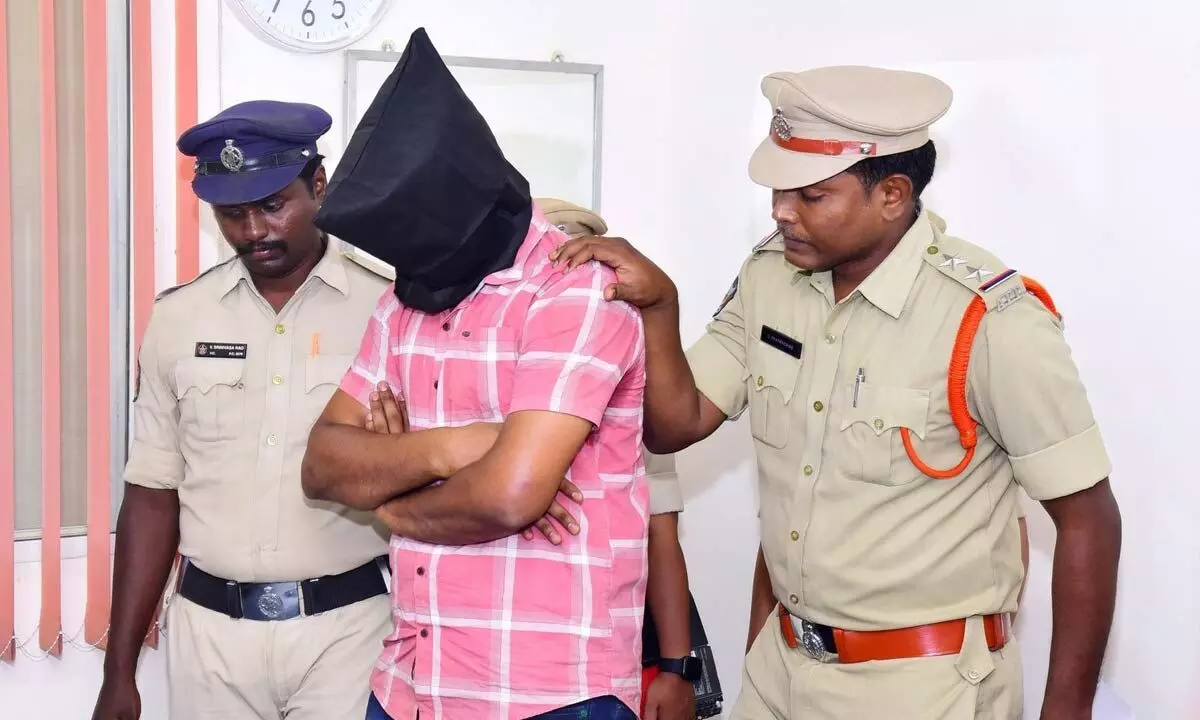 The police presenting the accused before the media in Vijayawada on Sunday