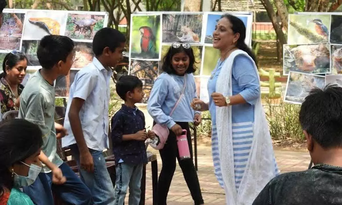 Children engrossed in a storytelling session at Indira Gandhi Zoological Park held in Visakhapatnam