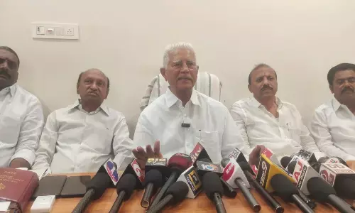 Former TDP MLA J Varadarajula Reddy addressing media persons in Proddaturu on Sunday