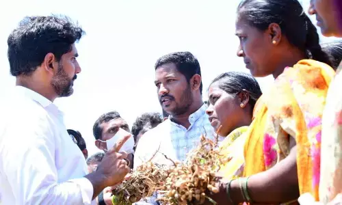 Groundnut farmers interacting with TDP national general secretary Nara Lokesh in Singanamala constituency on Sunday