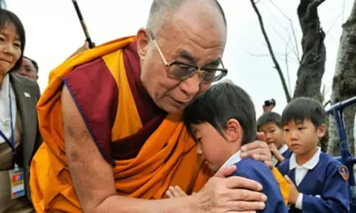 Dalai Lama apologises to boy, his family