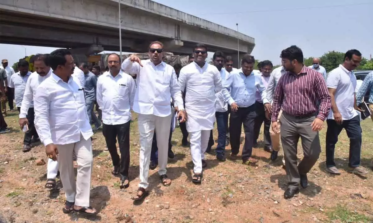 Minister for industries G Amarnath, ZP Chairman Chinna Srinu and others inspecting the site