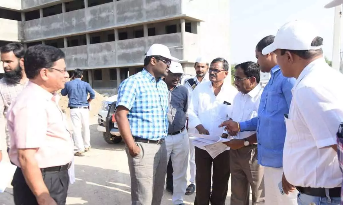 Collector Rajiv Gandhi Hanumanthu inspecting construction works of minority residential school in Nizamabad on Monday