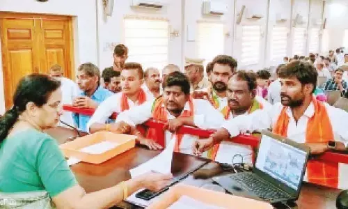 Prakasam district BJYM president K Vishnuvardhan Reddy and other leaders submitting a  representation to DRO R Srilatha at Spandana programme in Ongole on Monday
