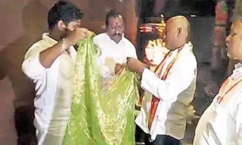 Siricilla handloom weaver offers saree that fits in match box to Vijayawada Indrakeeladri temple