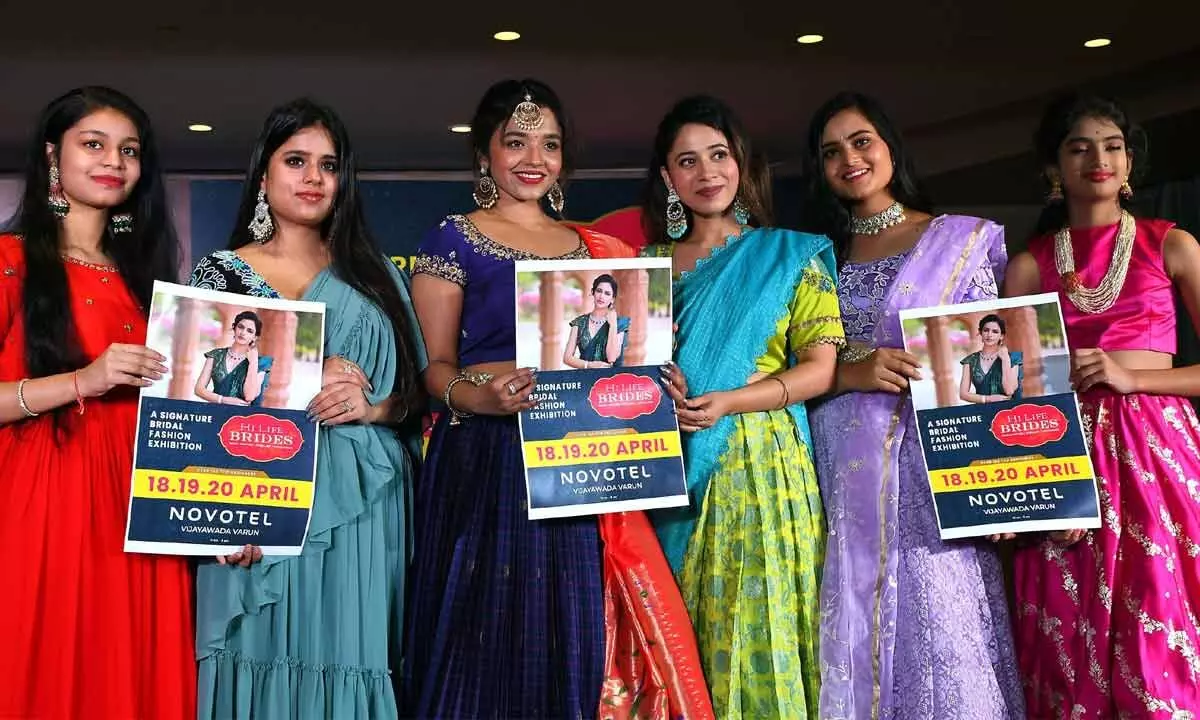 Models releasing a brochure on Hilife Brides exhibition in Vijayawada on Wednesday