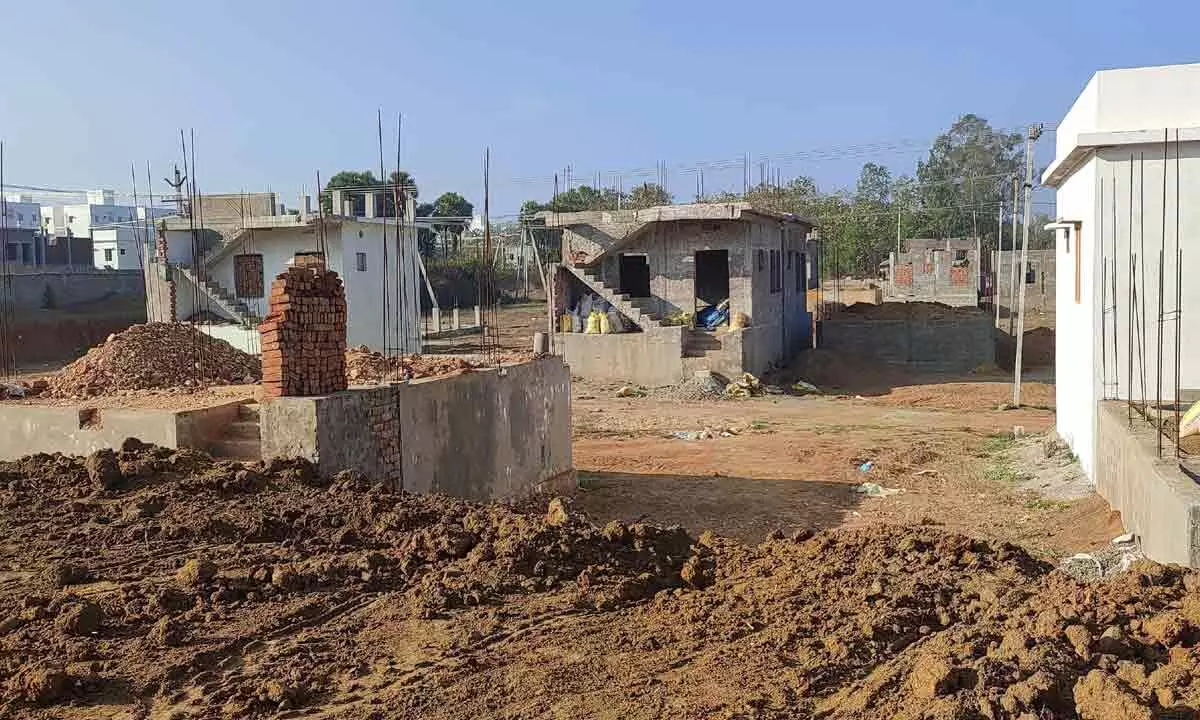 Houses at various stages of construction at YSR Jagananna colonies at Ragolu and Patrunivalasa villages in Srikakulam rural mandal