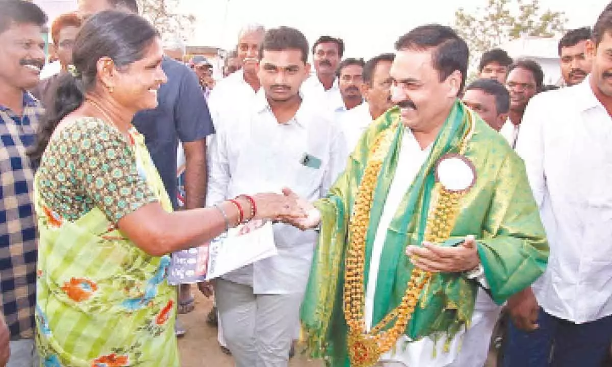 Agriculture Minister Kakani Govardhan Reddy interacting with a woman during the Gadapa Gadapaku Mana Prabhutvam at Surayapalem village of Pidalakuru mandal on Thursday