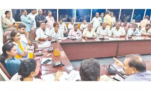 Mayor Dr Sirisha, Municipal Commissioner D Haritha, Dy Mayors B Abhinay Reddy, Mudra Narayana and others discussing with leaders of health workers union in Tirupati on Thursday