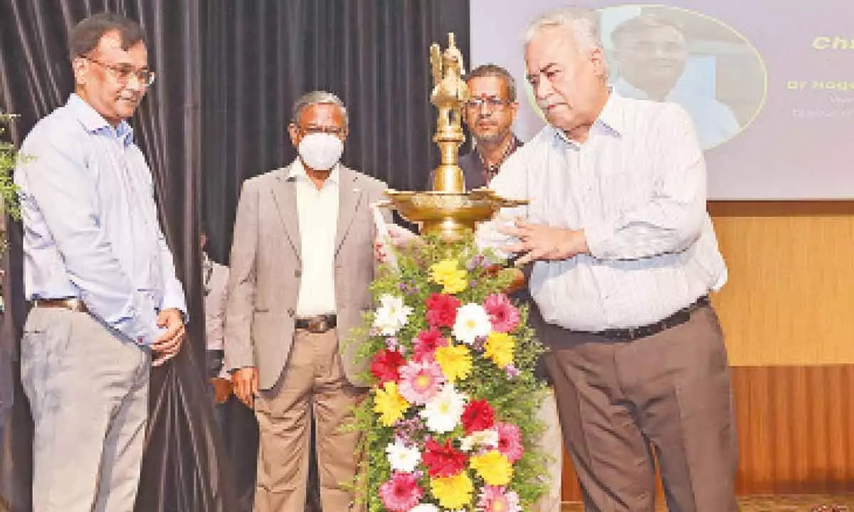 Vice-chancellor of SRM University-AP Manoj K Arora along with chief guest Dr Nagendra V Chowdary lighting the lamp to mark the inauguration of Ameya fest at SRM-AP at Neerukonda in Guntur district on Wednesday