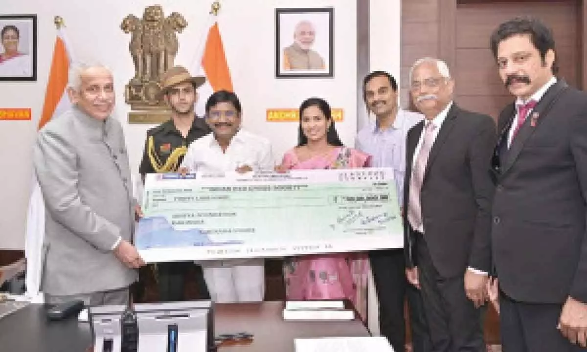 Dr A Sridhar Reddy, Chairman, and AK Parida, General Secretary & CEO of Indian Red Cross Society, AP State branch, handing over a cheque towards Climate Action Fund to Governor and President of IRCS of AP S Abdul Nazeer at Raj Bhavan in Vijayawada on Thursday