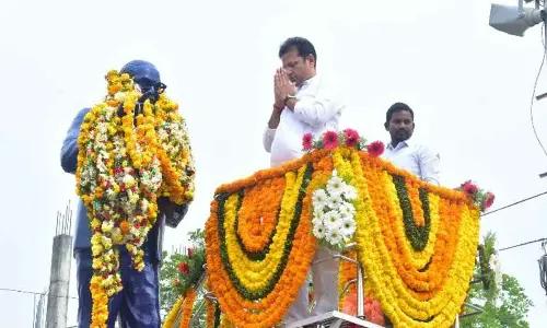 MLA Duddilla Sridhar Babu paying tributes to Ambedkar’s statue in Manthani on Friday