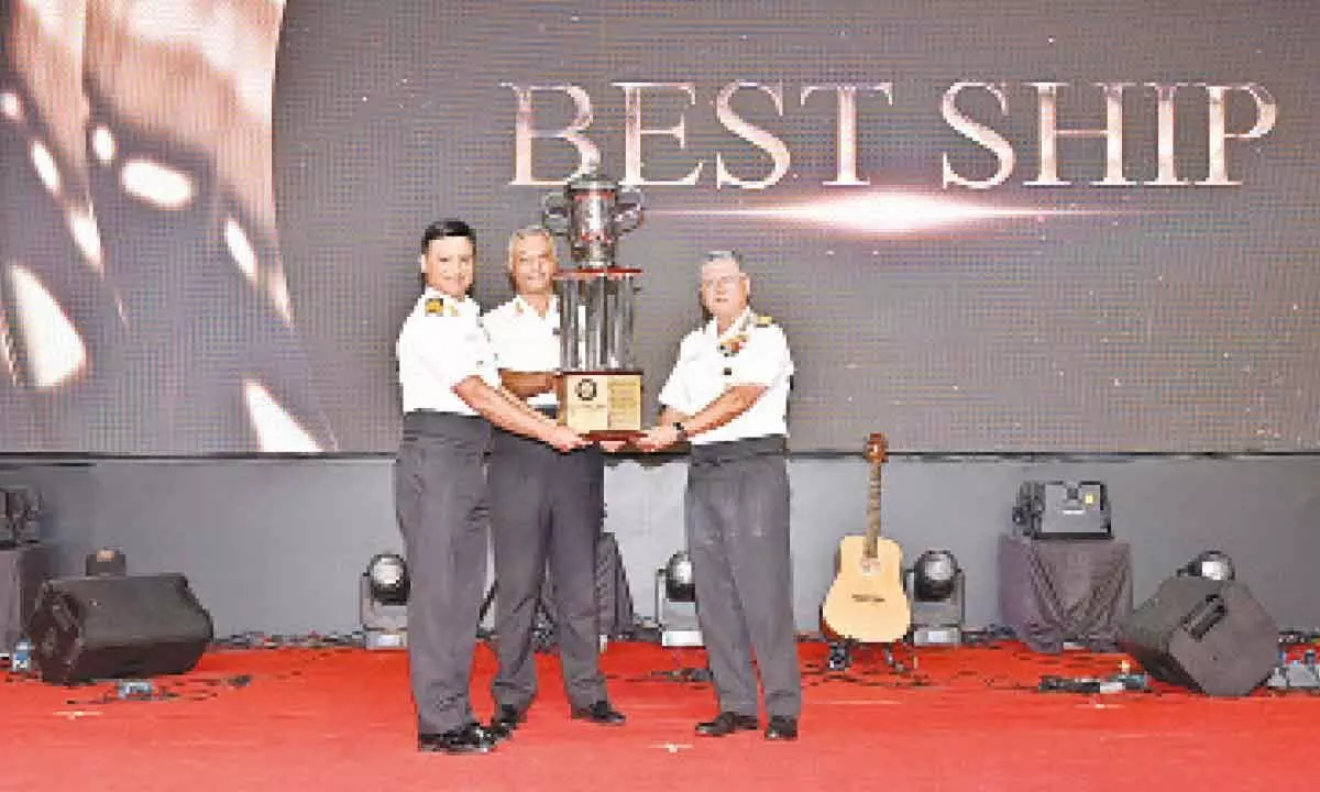 Commanding Officer INS Sahyadri Captain Rajan Kapoor receiving the Best Ship Trophy from Flag Officer Commanding-in-Chief, ENC, Vice Admiral Biswajit Dasgupta