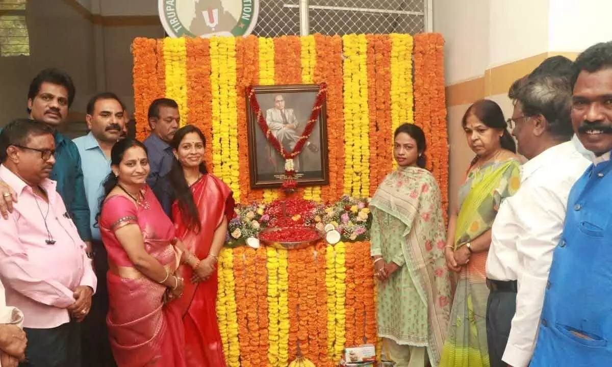 Mayor Dr R Sirisha and Municipal Commissioner D Haritha paying tributes to B R Ambedkar in Tirupati on Friday