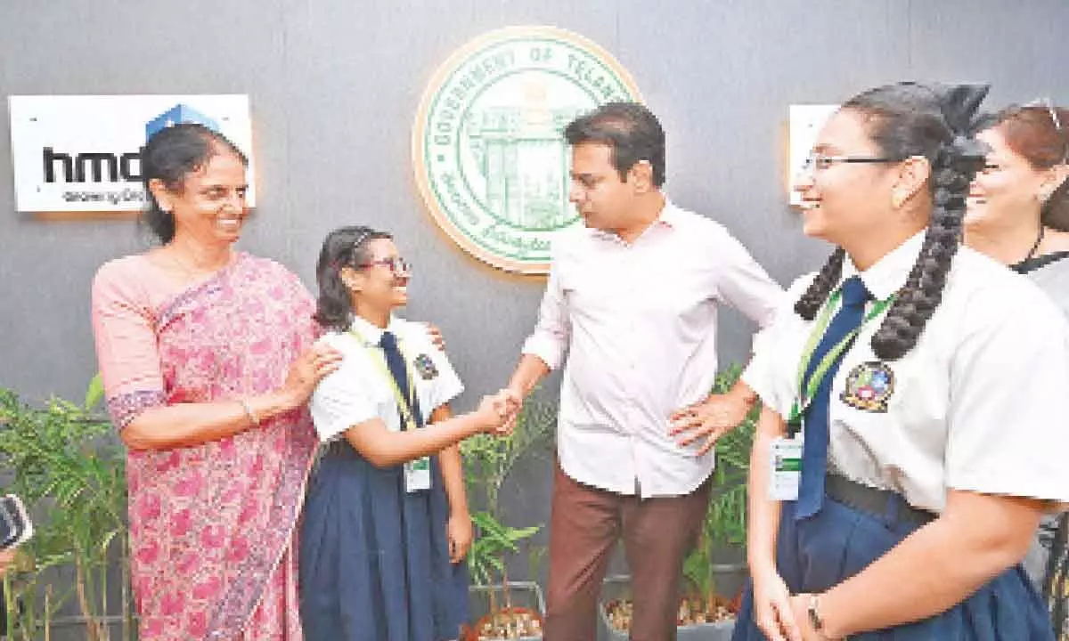 IT Minister KT Rama Rao with We Hub’s Young Innovators Manasa and Nafeesa  after handing over seed investment to them in Hyderabad on Saturday