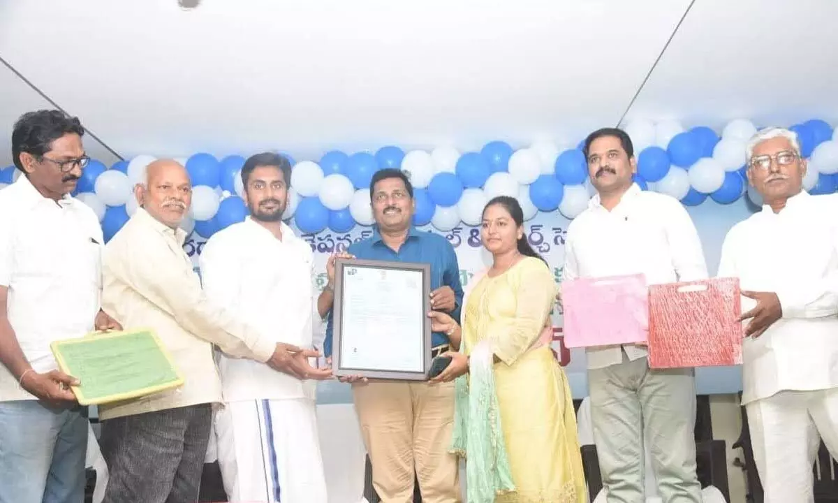 Deputy Mayor Bhumana Abhinay Reddy with Bhaskar Raju and others showing the patent  certificate in Tirupati on Sunday