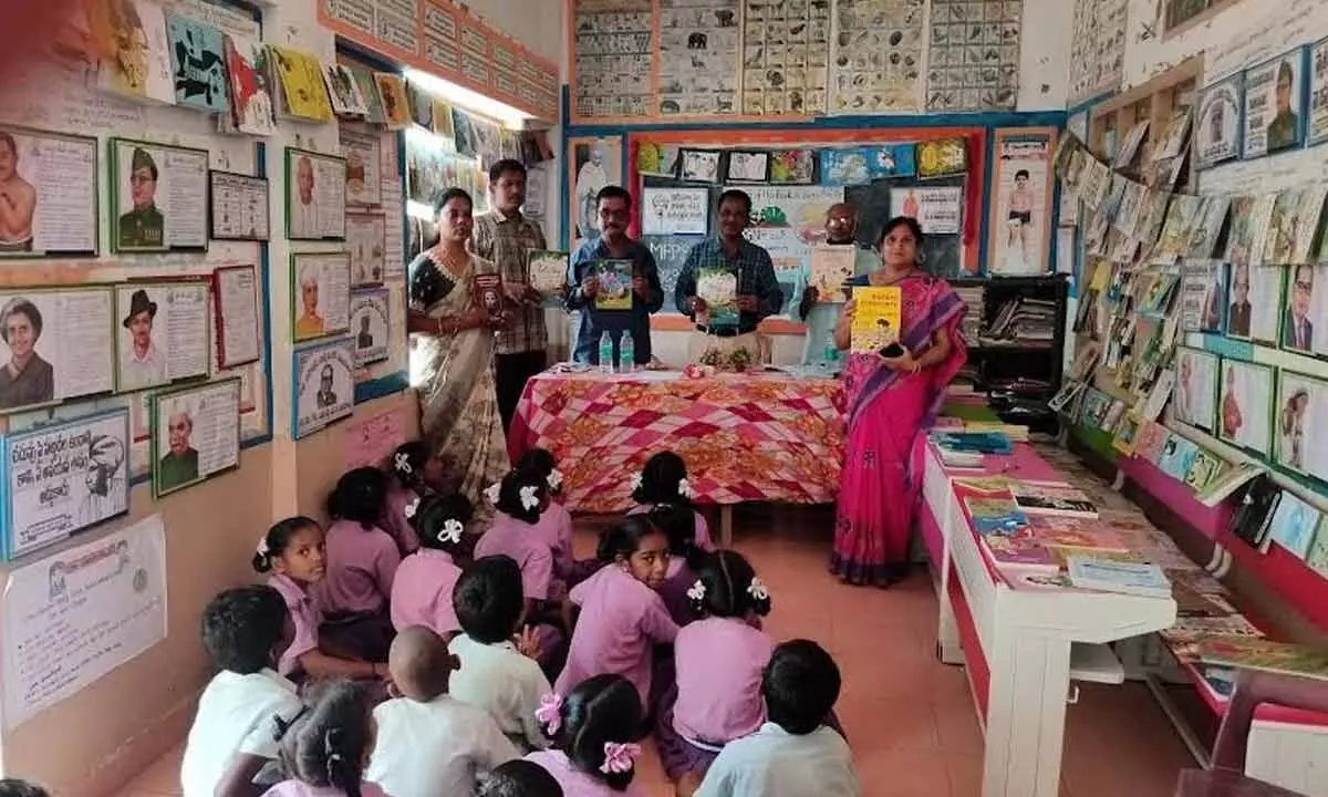 Students in a government school reading books during the library period