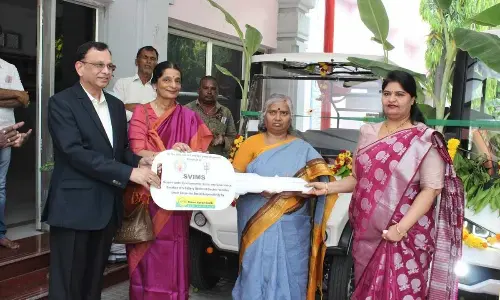 Karur Vysya Bank chairperson Meena Hemachandra and MD B Ramesh Babu handing over the key of batter vehicles to TTD JEO Sada Bhargavi and SVIMS director Dr B Vengamma in Tirupati on Tuesday