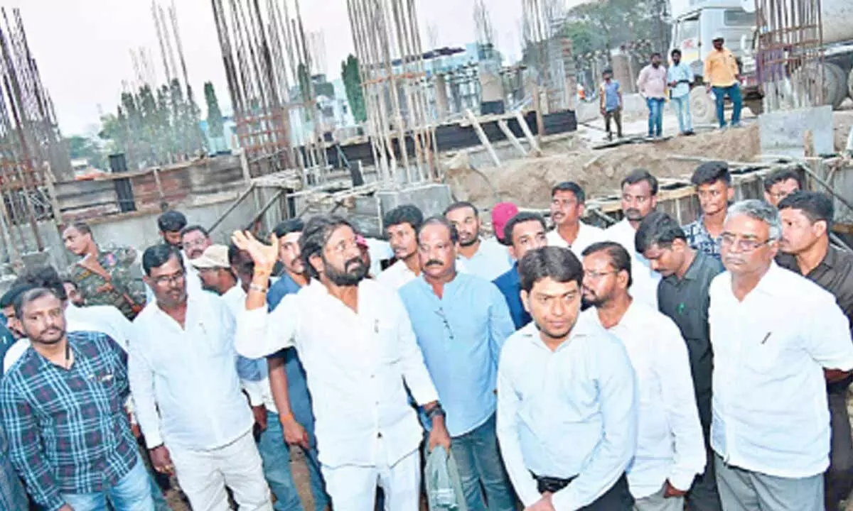 Minister Dr V. Srinivas and district collector G Ravi Nayak inspecting the works of District super speciality hospital in place of old district colelctorate building on Wednesday