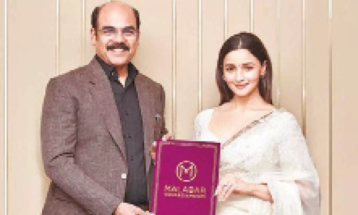 Actress Alia Bhatt with managing director - India of Malabar Gold and Diamonds Asher O
