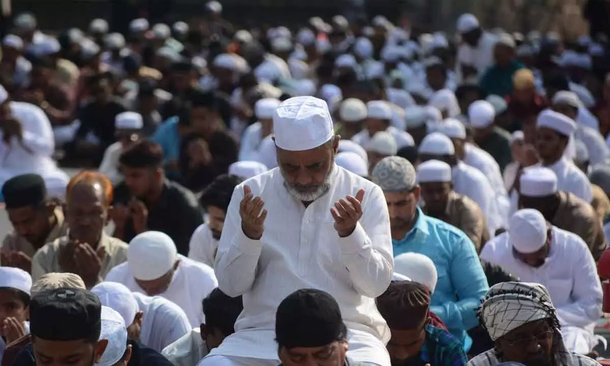 After a month of fasting and devotional connect with God, Muslims gathered to offer prayers on the occasion of Eid-ul-Fitr at Masab Tank in Hyderabad on Saturday. Photo: Srinivas Setty