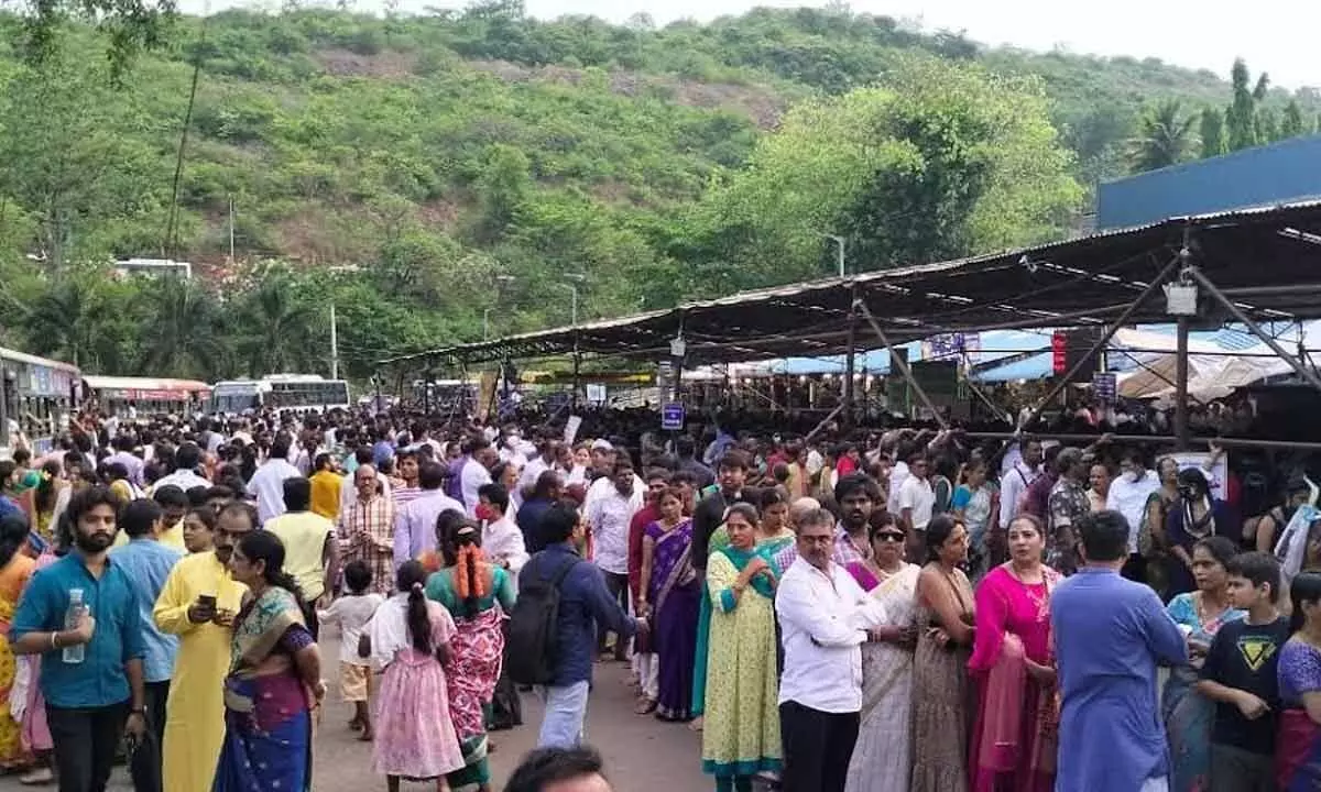 Common devotees waiting for hours in queue at Simhachalam temple on Sunday