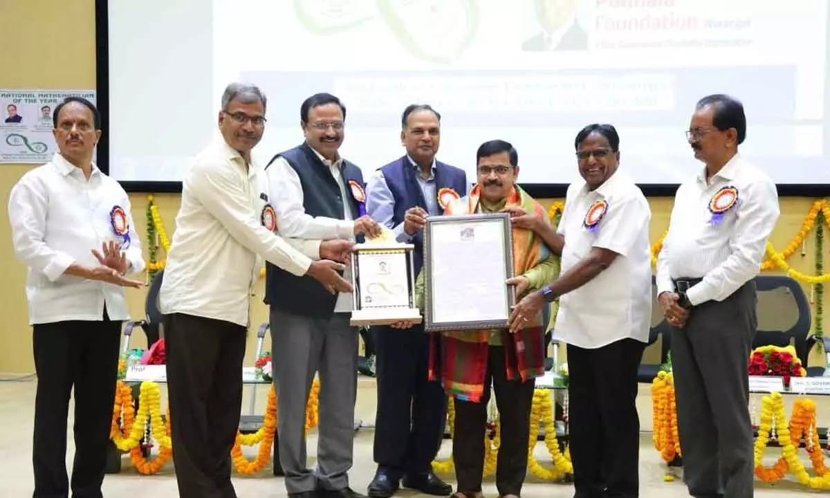 Professor of Mathematics, IIT Kharagpur, Dr. G P Rajasekhar receiving Mathematician of the Year-2023 award instituted by the Ponnala Foundation in association with the National Institute of Technology, Warangal, (NITW) on Monday.