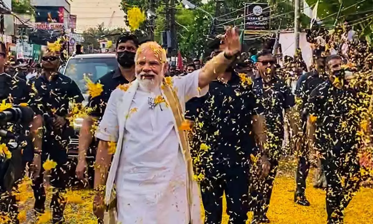 Prime Minister Narendra Modi during a roadshow in Kochi on Monday