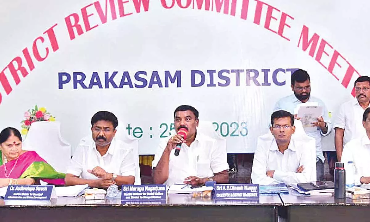 Social Welfare Minister M Nagarjuna speaking at Prakasam District Review Committee meeting in Ongole on Tuesday.  MAUD Minister Audimulapu Suresh, District Collector AS Dinesh Kumar and ZP chairperson Buchepalli Venkayamma are also seen.