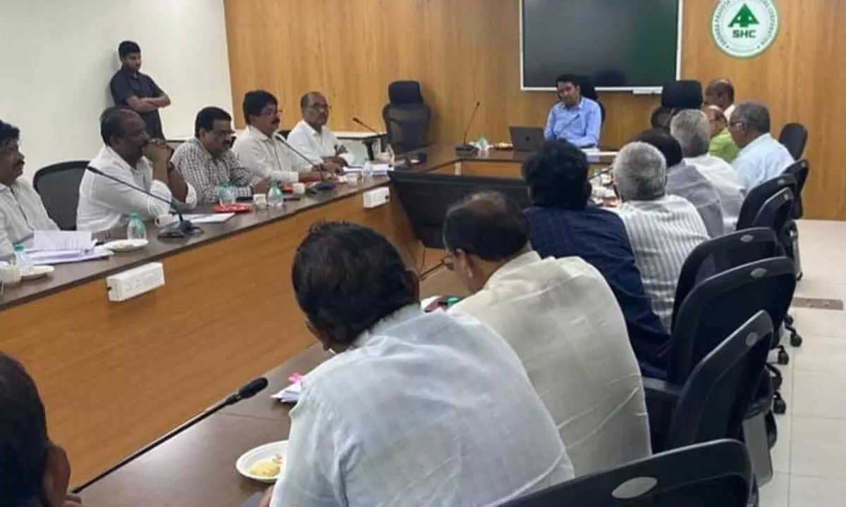 APSHCL MD Lakshmisha addressing the Housing Joint Action Committee meeting at the  department head office in Vijayawada on Tuesday
