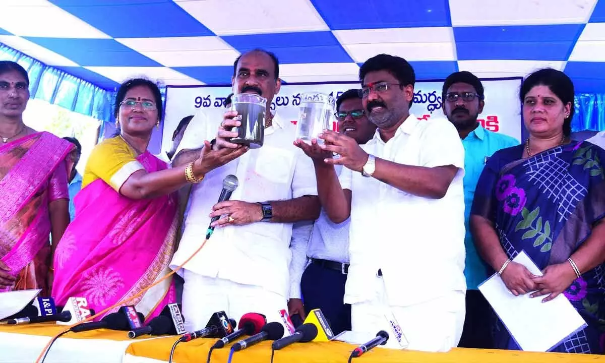 MAUD Minister Dr Audimulapu Suresh, MLA Balineni Srinivasa Reddy and Mayor Gangada Sujatha showing the untreated and treated water from STP inaugurated in Ongole on Wednesday