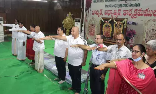 TTD EO A V Dharma Reddy administering a pledge to the staff members at Tirumala on Sunday that they will strive their best to protect the sanctity and serenity of the holy hills and improve greenery
