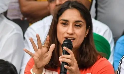 Wrestler Vinesh Phogat speaks with the media during their protest at Jantar Mantar, in New Delhi