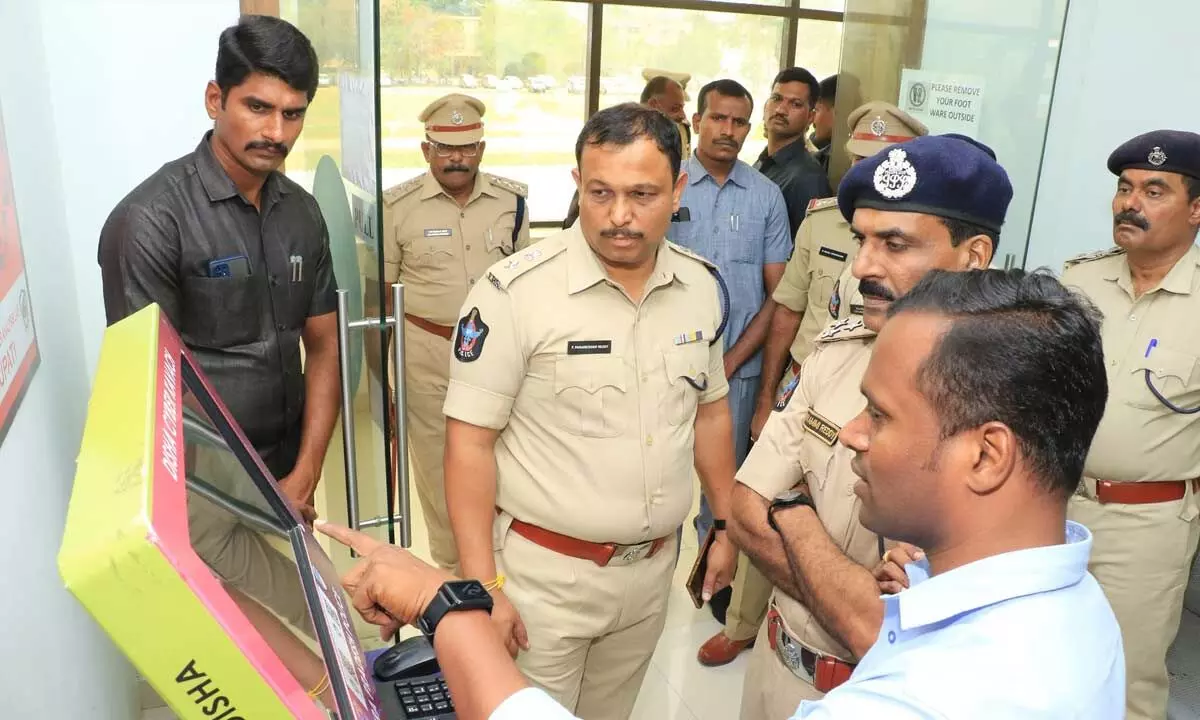 DIG RN Ammi Reddy and SP P Parameswar Reddy observing the functioning of DISHA App in Tirupati on Tuesday