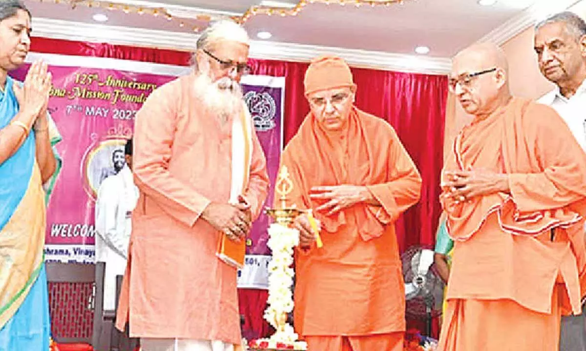 Ramakrishna  Mission Ashrama  secretary Swami  Sukritananda  inaugurating the  programme by lighting  lamp in Tirupati  on Sunday.   In-charge Vice  Chancellor of  SV Vedic University Prof Rani Sadasiva Murthy and others are seen.