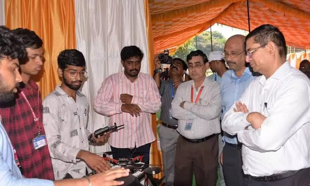 Director of NSTL Y Sreenivas Rao going through the exhibits put up by students at NSTL in Visakhapatnam on Tuesday