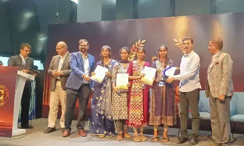 Telangana Principal Secretary, Information Technology Jayesh Ranjan presenting the award to the students at CSI Hyderabad Chapter Excellence Awards-2023 ceremony at T-Hub in Hyderabad on Monday