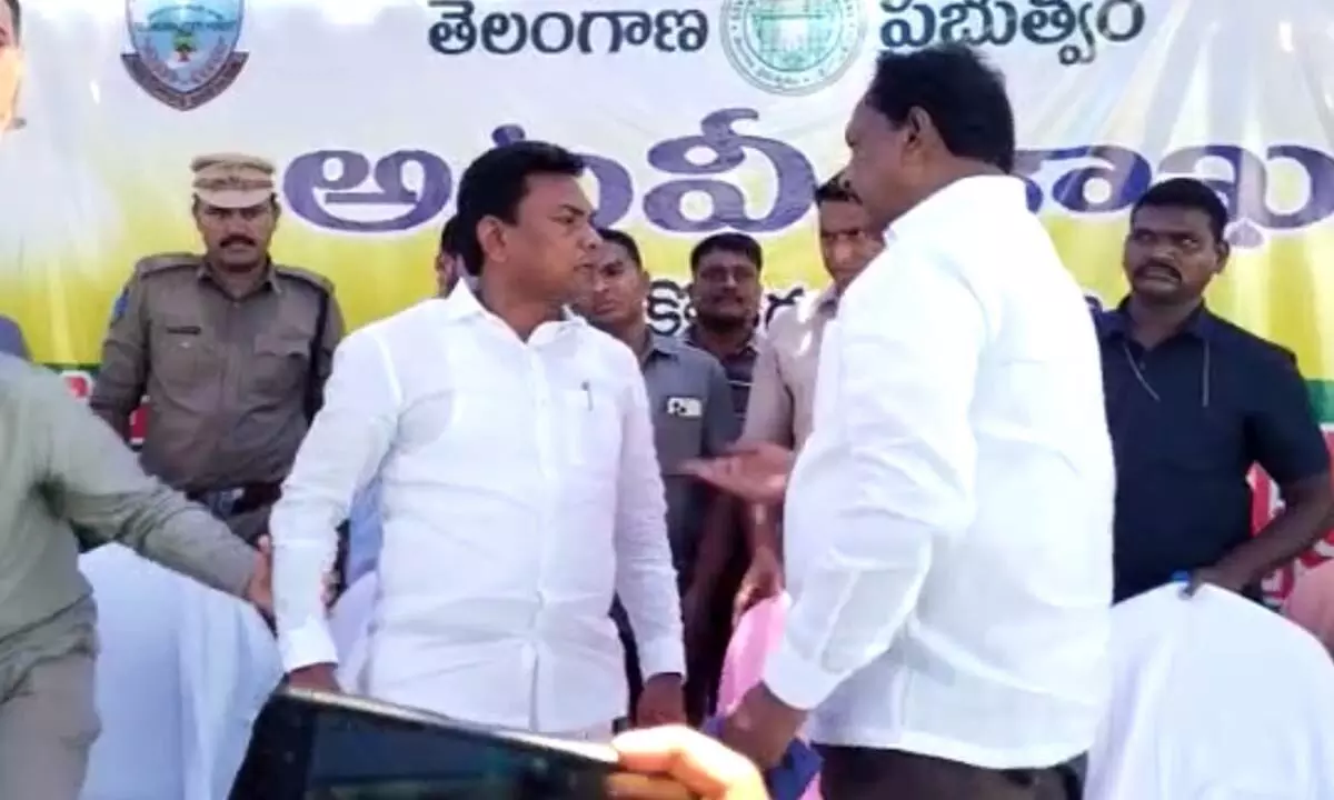 MLAs Rega Kantha Rao and Podem Veeraiah in a heated argument in the presence of minister Indrakaran Reddy in a government programme at Laxmipuram in Kothagudem district on Wednesday.