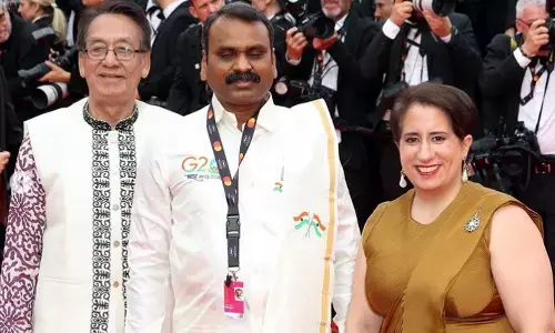 Guneet Monga walked on the red carpet with pride wearing a golden saree!