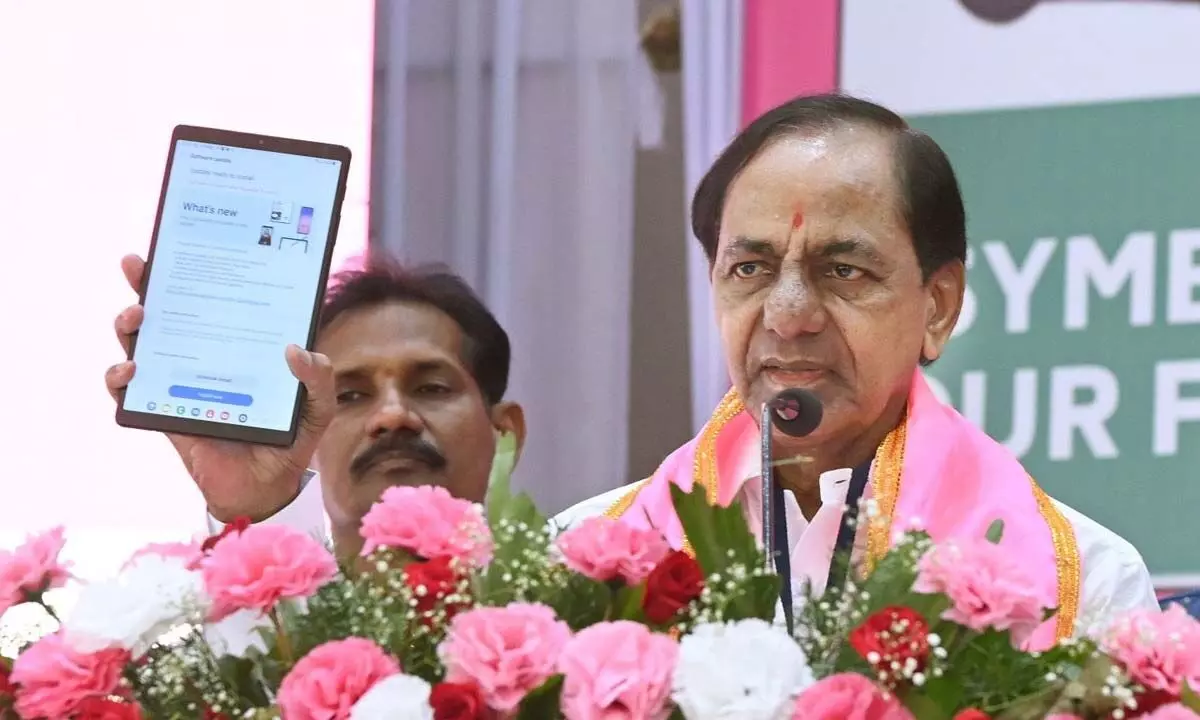 BRS president K Chandrashekar Rao displaying a tab to be distributed to cadre at a training camp, in Nanded on Friday. KCR explained to the party workers how to use the tabs and smart gadgets for social media campaign to promote the party in Maharashtra