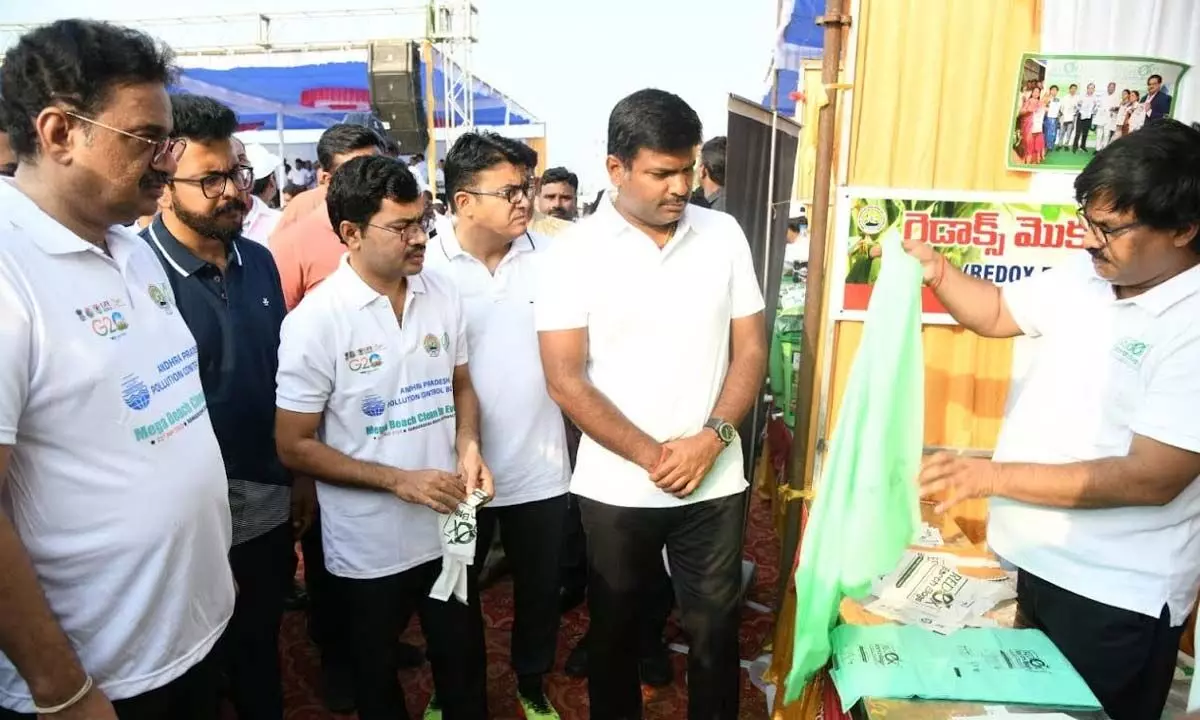 IT Minister Gudivada Amarnath and officials visiting stalls that sell up cycled products at RK Beach in Visakhapatnam on Sunday