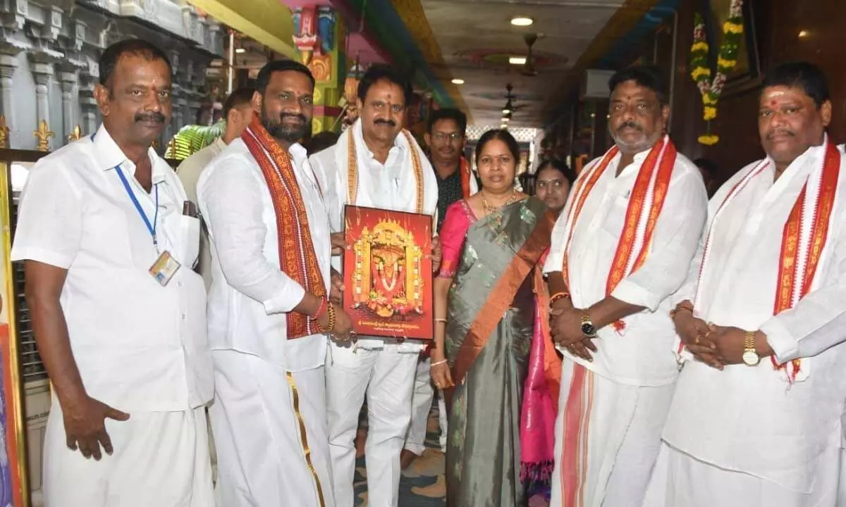 Temple Trust Board Chairman Karnati Ramabu presenting Goddess Kanaka Durga portrait to MP Mopidevi Venkata Ramana at the temple in Vijayawada on Sunday